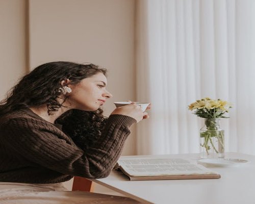 Person enjoying peaceful morning routine outdoors